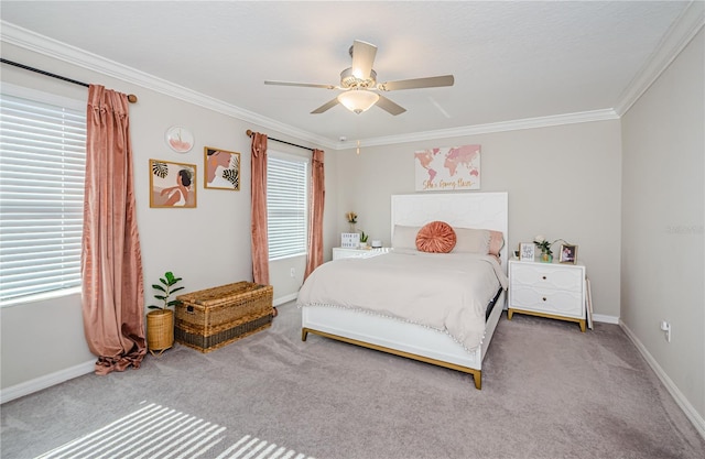 carpeted bedroom featuring ceiling fan, crown molding, and multiple windows