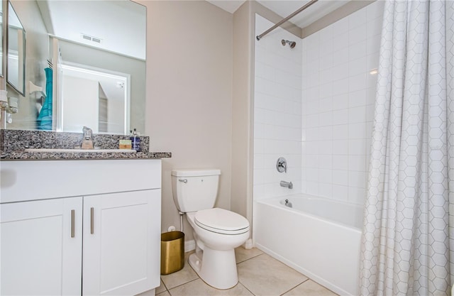 full bathroom featuring tile patterned floors, vanity, toilet, and shower / bath combo with shower curtain