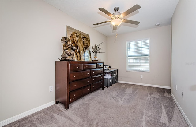 bedroom featuring ceiling fan and light carpet