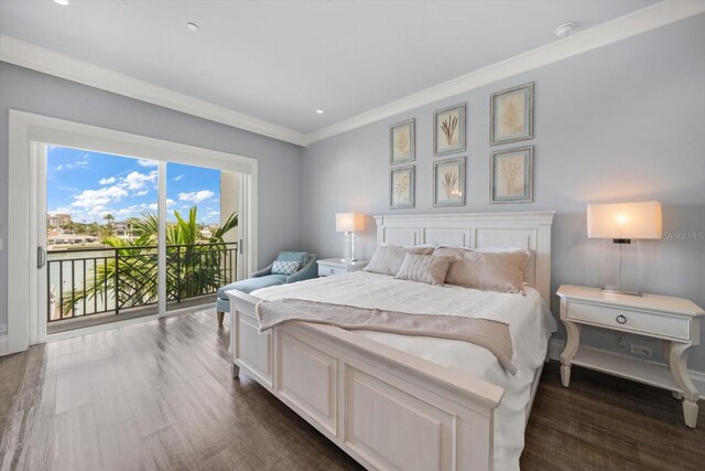 bedroom with access to outside, dark hardwood / wood-style floors, and ornamental molding