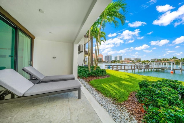 view of patio featuring a boat dock and a water view