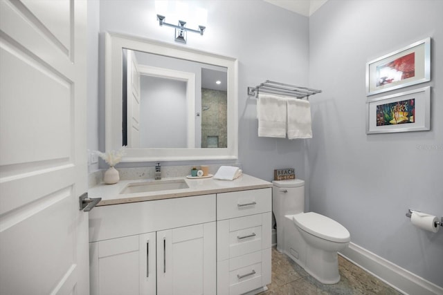 bathroom with vanity, toilet, and tile patterned floors