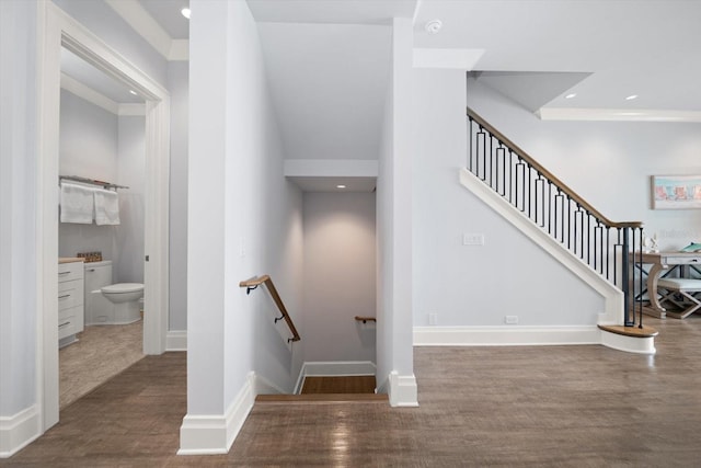 staircase featuring wood-type flooring