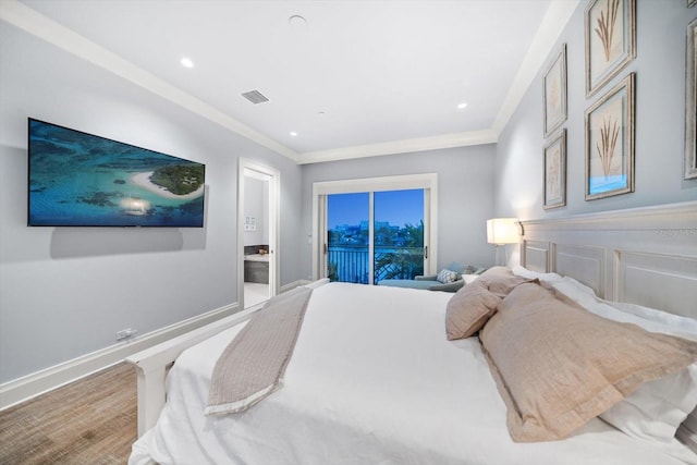 bedroom with crown molding, hardwood / wood-style flooring, and access to outside