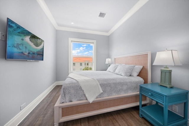 bedroom with dark hardwood / wood-style flooring