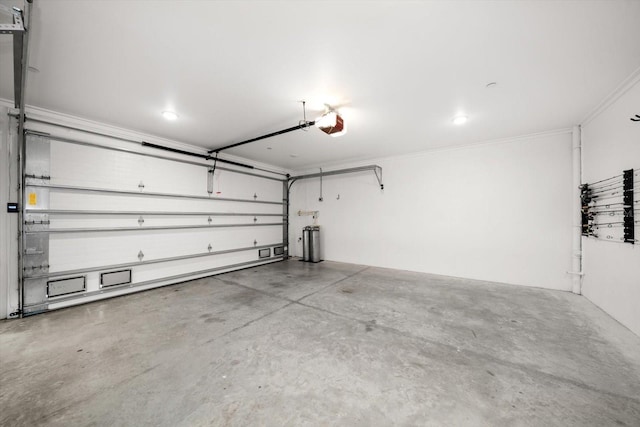 garage featuring a garage door opener and water heater