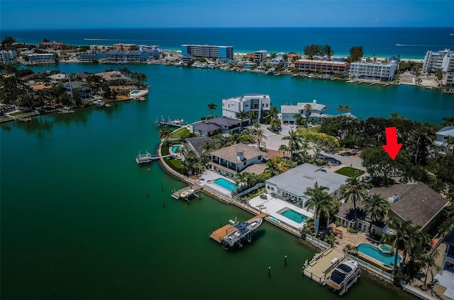 birds eye view of property with a water view