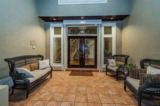 view of exterior entry featuring french doors