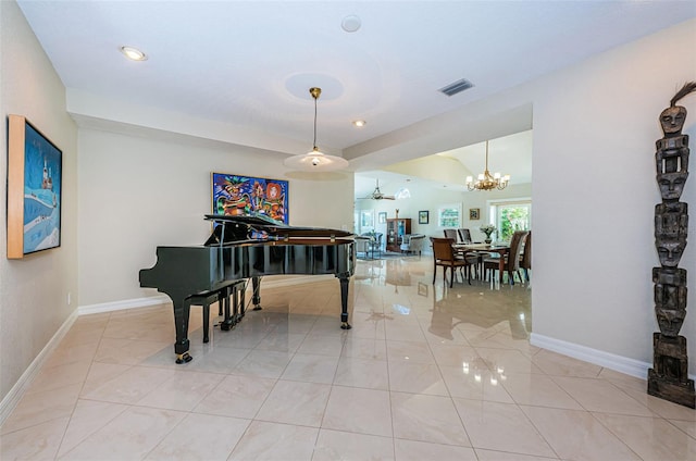 miscellaneous room with a notable chandelier and light tile patterned floors