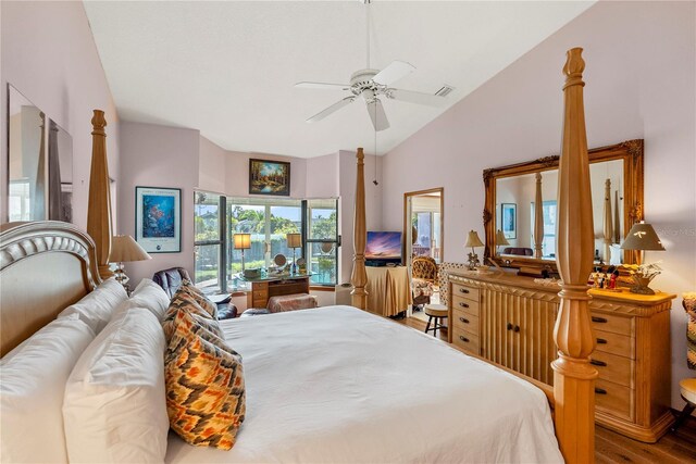 bedroom featuring ceiling fan, vaulted ceiling, and hardwood / wood-style floors