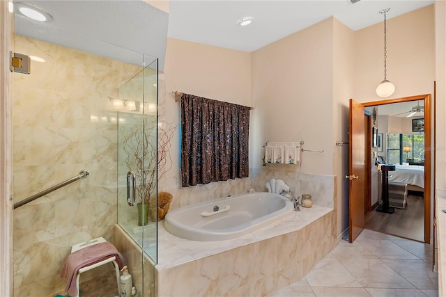 bathroom featuring plus walk in shower and tile patterned floors