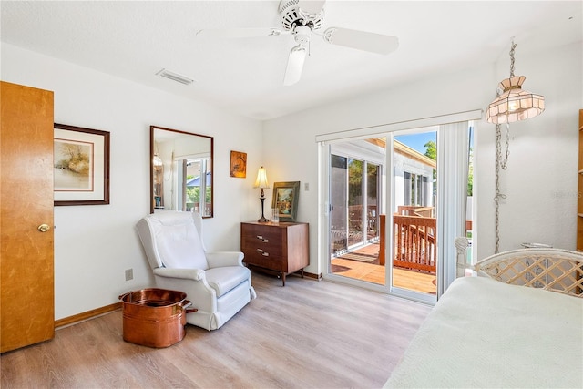 bedroom featuring access to outside, ceiling fan, and light wood-type flooring