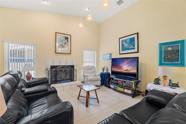 tiled living room with a fireplace