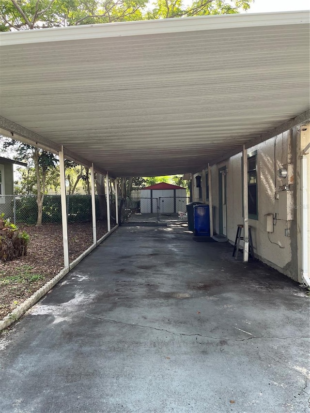 view of parking / parking lot featuring a carport