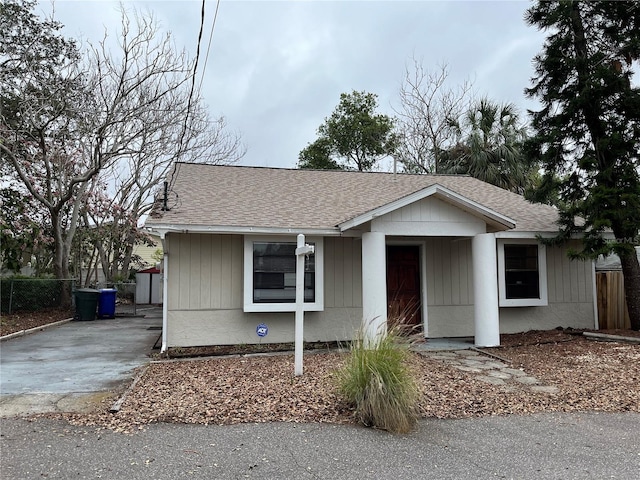 view of front of home featuring roof with shingles