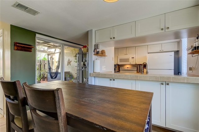 dining space featuring sink