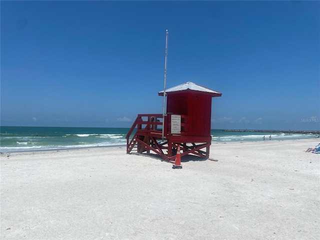 property view of water featuring a beach view