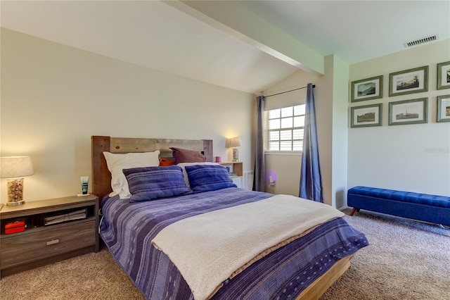 carpeted bedroom with vaulted ceiling with beams