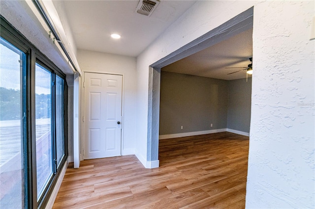 hallway featuring wood-type flooring