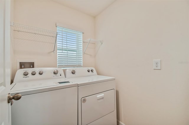 laundry area with washing machine and clothes dryer