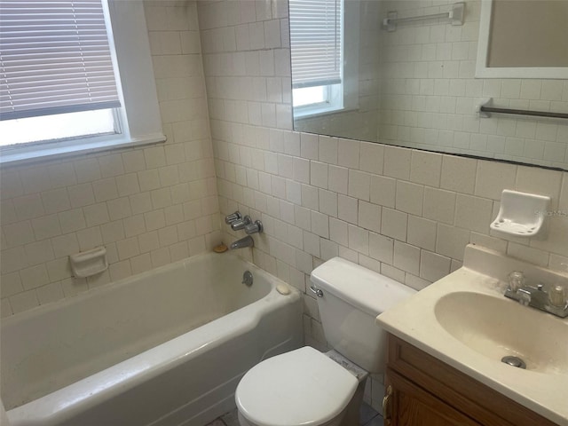 full bathroom featuring vanity, backsplash, toilet, and tiled shower / bath combo