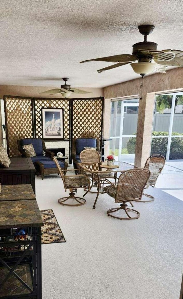 exterior space featuring ceiling fan