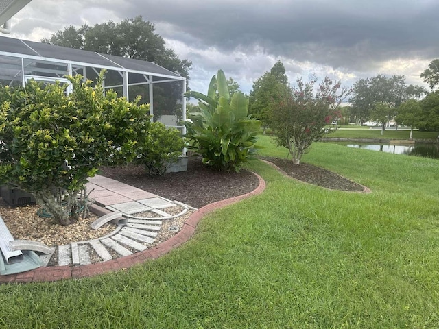 view of yard featuring a lanai