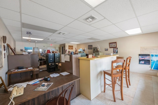 interior space featuring a paneled ceiling