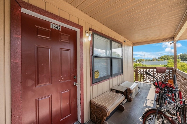 doorway to property featuring covered porch