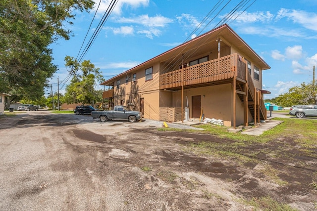 view of home's exterior featuring a balcony