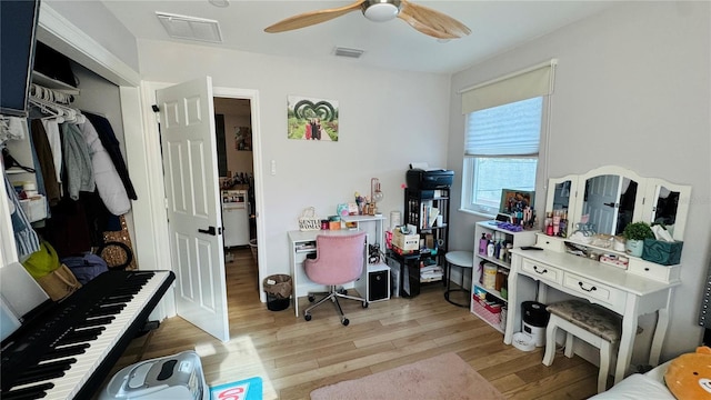 home office featuring ceiling fan and light wood-type flooring