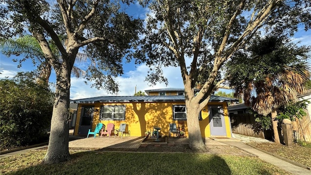 back of property featuring a patio