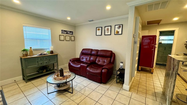 tiled living room with crown molding and a wealth of natural light