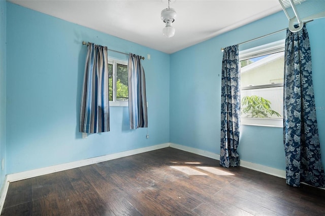 empty room with dark hardwood / wood-style floors