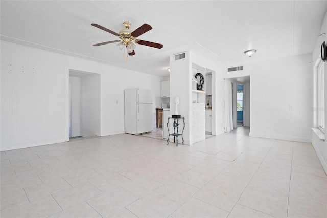 unfurnished living room featuring light tile patterned flooring and ceiling fan