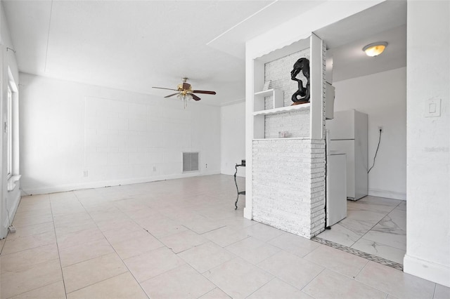 unfurnished living room with ceiling fan