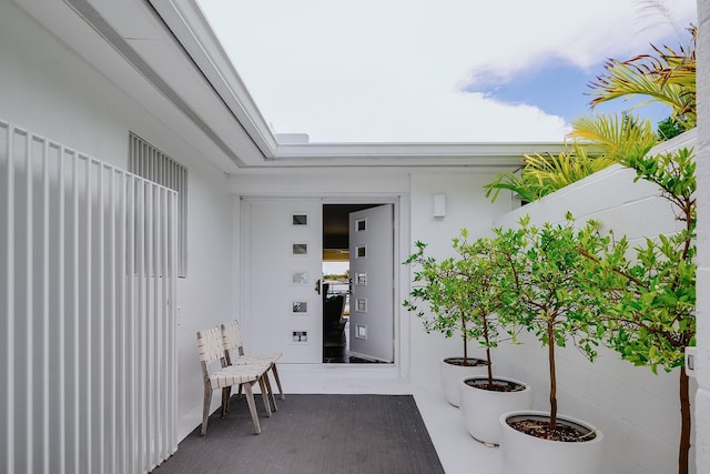 doorway to property with stucco siding