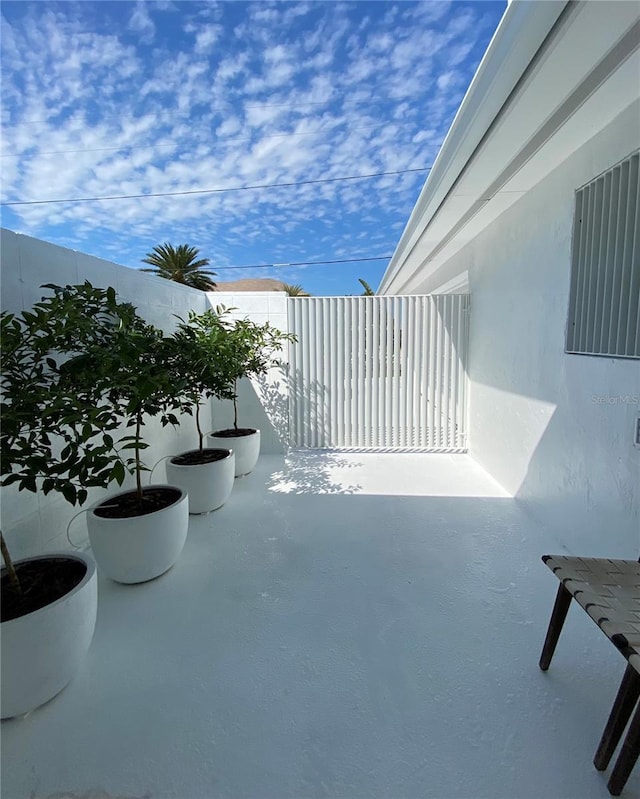 440 64th Ave, St Pete Beach, FL 33706 - view of patio with a balcony