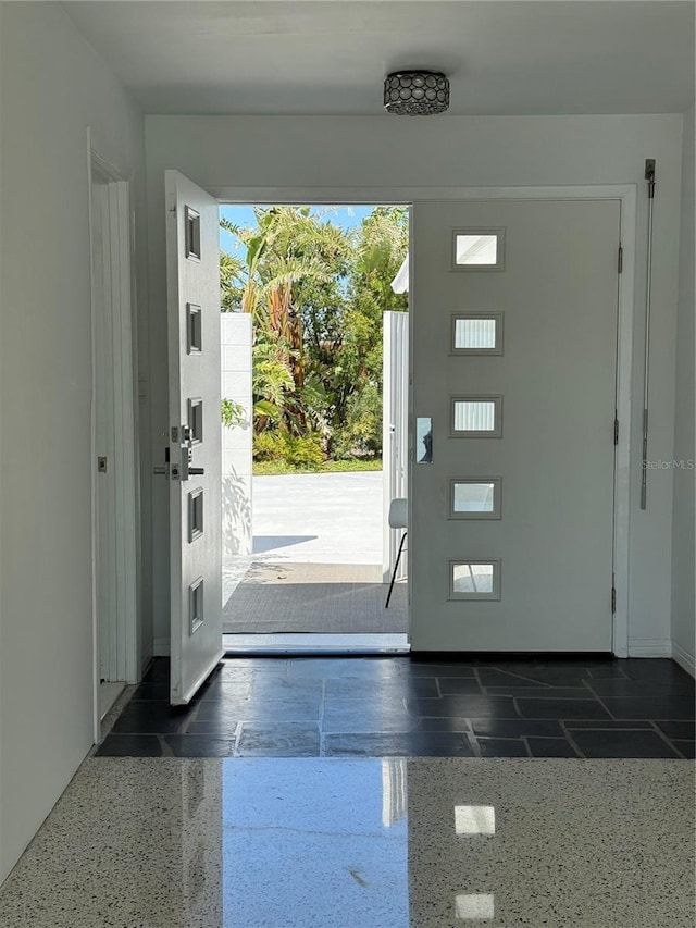 440 64th Ave, St Pete Beach, FL 33706 - entrance foyer with baseboards and light speckled floor