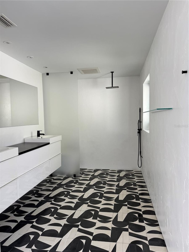 440 64th Ave, St Pete Beach, FL 33706 - bathroom with vanity and a walk in shower