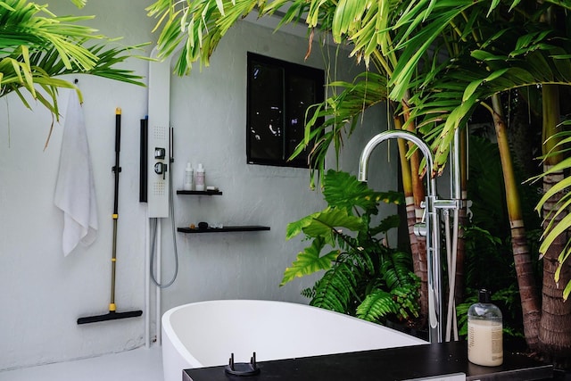 440 64th Ave, St Pete Beach, FL 33706 - full bathroom featuring a freestanding bath