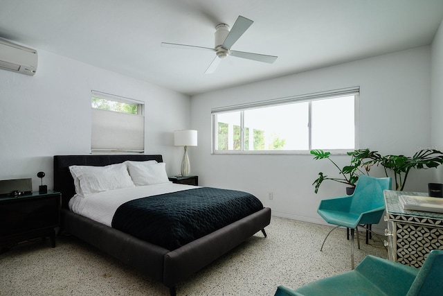 440 64th Ave, St Pete Beach, FL 33706 - bedroom featuring speckle patterned floor, an AC wall unit, multiple windows, and baseboards