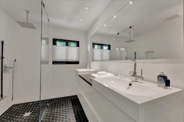 440 64th Ave, St Pete Beach, FL 33706 - bathroom featuring walk in shower, vanity, and recessed lighting