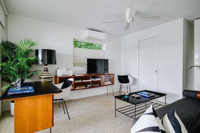 440 64th Ave, St Pete Beach, FL 33706 - living room featuring speckled floor, a wall mounted air conditioner, an office area, and a ceiling fan