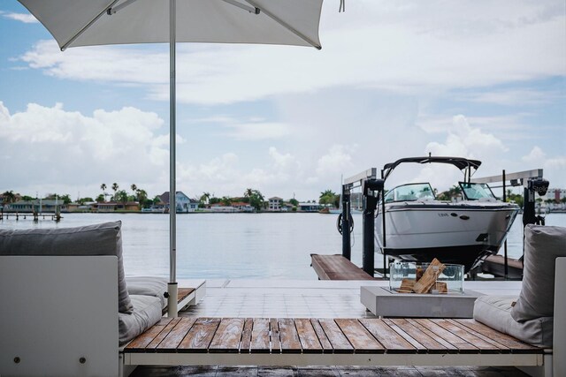 440 64th Ave, St Pete Beach, FL 33706 - dock area featuring a water view and boat lift
