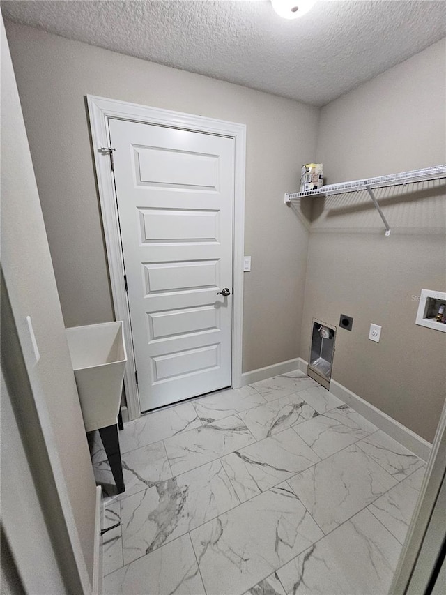 laundry area featuring marble finish floor, hookup for a washing machine, electric dryer hookup, laundry area, and baseboards