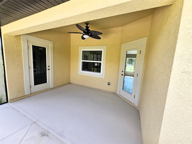 view of patio featuring ceiling fan