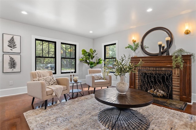 sitting room featuring dark hardwood / wood-style floors and a fireplace