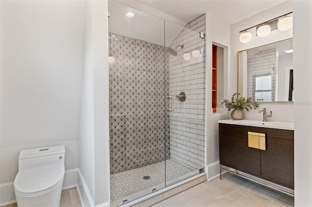 bathroom with vanity, a shower with shower door, and toilet