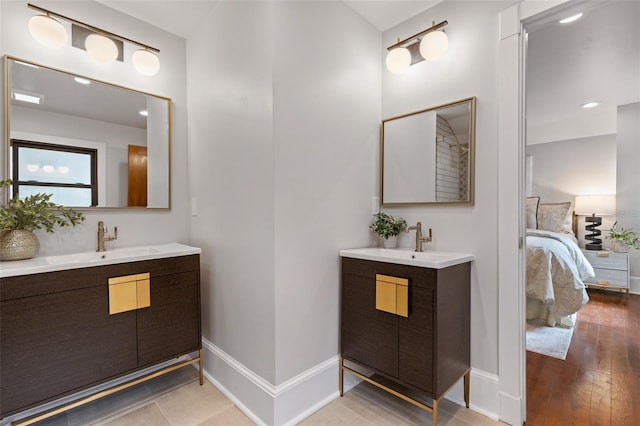 bathroom featuring vanity and wood-type flooring